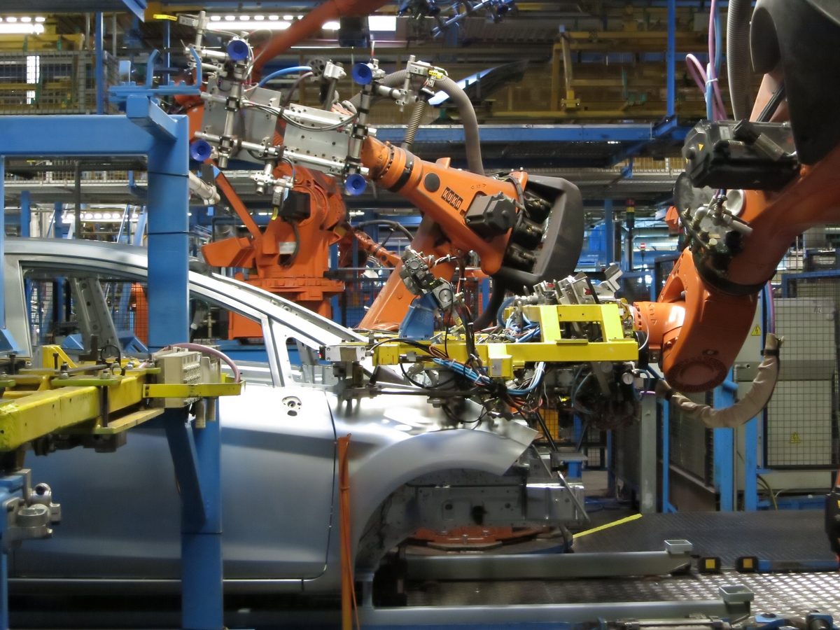 Industrial robots on an automotive production line, the kind of automation the Future Factories programme encourages.