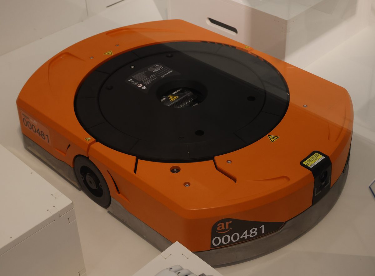An autonomous mobile robot of the type used in large fulfilment warehouses.
